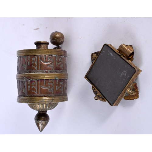 1024 - AN ANTIQUE TIBETAN PRAYER WHEEL together with a similar plaque. 151 grams. Largest 10.75 cm x 6 cm. ... 