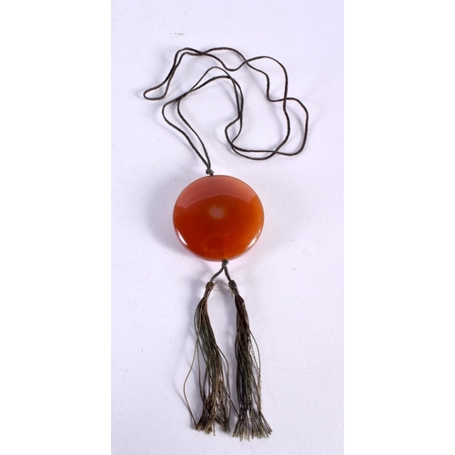 1034 - A CHINESE CARVED AGATE NECKLACE. 36.2 grams. 4.25 cm diameter.