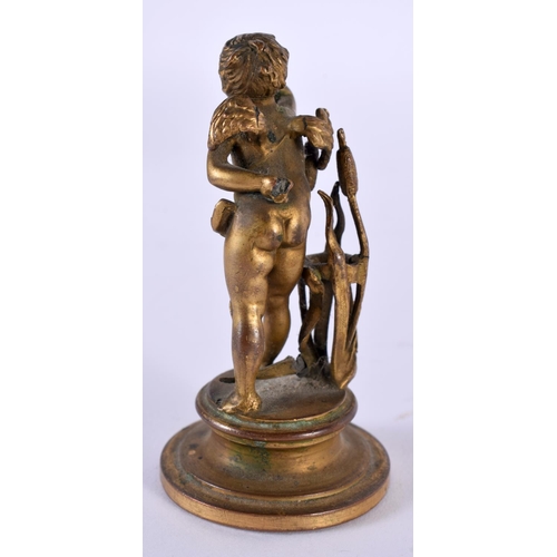 1049 - A SMALL 19TH CENTURY FRENCH BRONZE FIGURE OF A YOUNG BOY modelled amongst foliage. 66.6 grams. 7.25 ... 