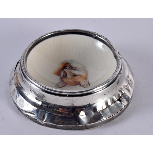 1050 - AN EDWARDIAN SILVER MOUNTED FOX PORCELAIN DISH. 84 grams overall. 8.25 cm diameter.