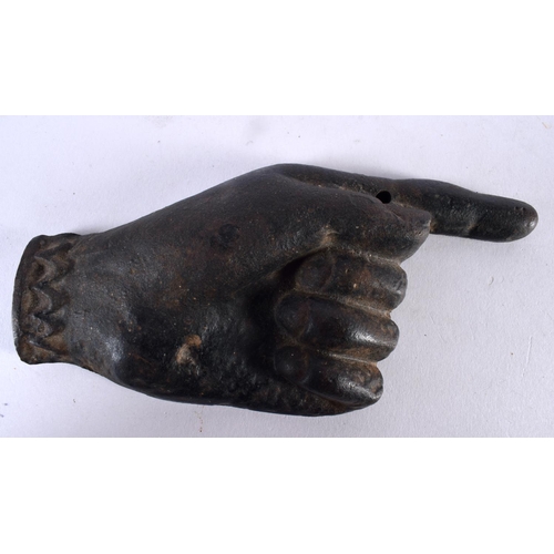 1062 - AN UNUSUAL ANTIQUE CAST IRON FINGER POINTING PLAQUE DESK PAPERWEIGHT. 646 grams. 15.5 cm x 7.5 cm.