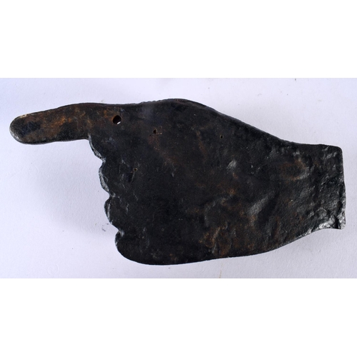 1062 - AN UNUSUAL ANTIQUE CAST IRON FINGER POINTING PLAQUE DESK PAPERWEIGHT. 646 grams. 15.5 cm x 7.5 cm.