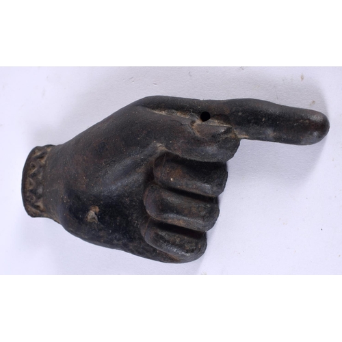 1062 - AN UNUSUAL ANTIQUE CAST IRON FINGER POINTING PLAQUE DESK PAPERWEIGHT. 646 grams. 15.5 cm x 7.5 cm.