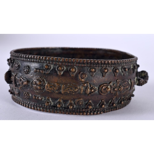 1064 - AN ANTIQUE TIBETAN MIDDLE EASTERN INDIAN NEPALESE BRONZE BANGLE decorated with buddhistic figures. 1... 