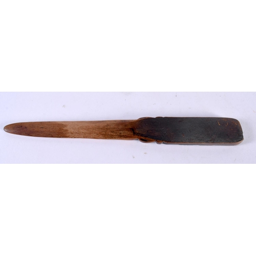 1066 - A NEW ZEALAND CARVED WOOD TRIBAL MAORI LETTER OPENER. 22cm long.