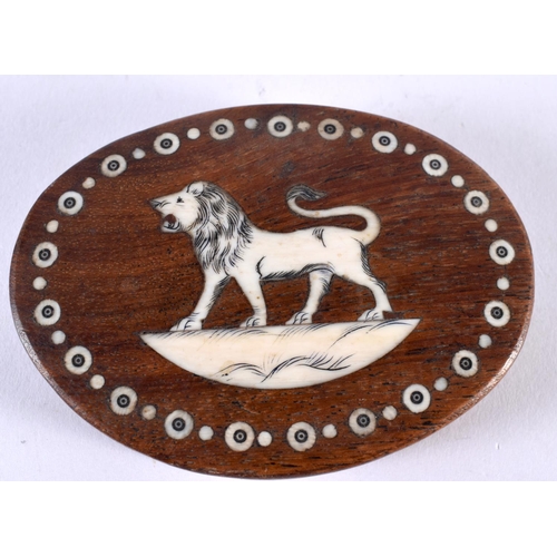 1072 - AN ANTIQUE ANGLO INDIAN HARDWOOD LION PAPERWEIGHT. 9 cm x 6.75 cm.