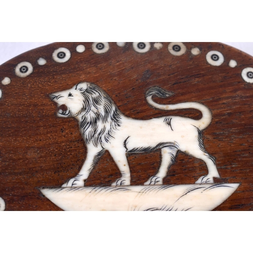 1072 - AN ANTIQUE ANGLO INDIAN HARDWOOD LION PAPERWEIGHT. 9 cm x 6.75 cm.