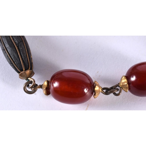 1073 - A MIDDLE EASTERN AMBER TYPE NECKLACE. 85 grams. 74 cm long.