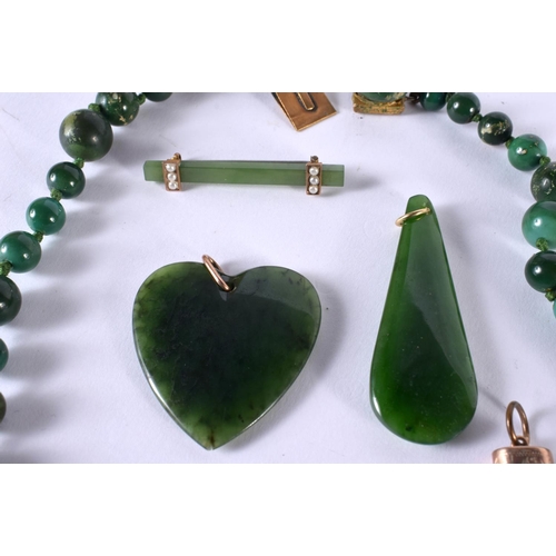 1079 - A CHINESE GOLD MOUNTED JADE PENDANT together with other jade jewelry. 130 grams. Largest 55 cm long.... 