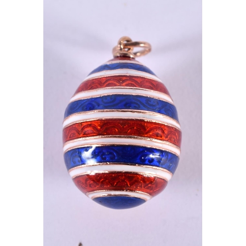 1113 - A RUSSIAN 14CT GOLD AND ENAMEL EGG PENDANT. 12.5 grams. 2.5 cm x 1.75 cm.