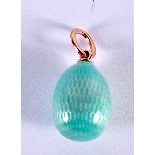 1121 - A RUSSIAN 14CT GOLD AND ENAMEL EGG PENDANT. 2.4 grams. 2 cm x 1.25 cm.