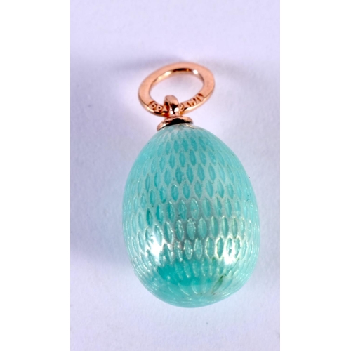 1121 - A RUSSIAN 14CT GOLD AND ENAMEL EGG PENDANT. 2.4 grams. 2 cm x 1.25 cm.