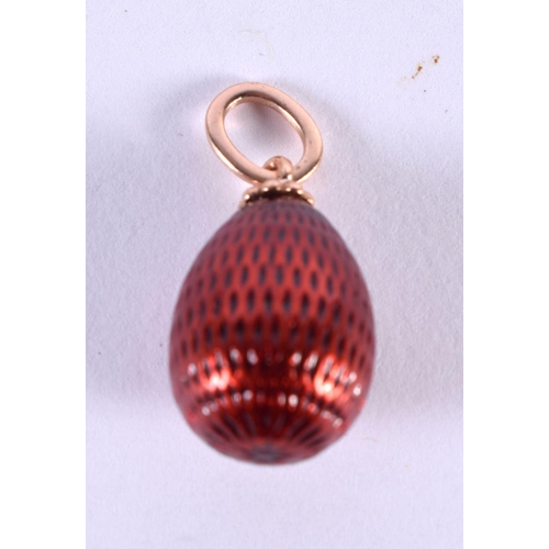 1122 - A RUSSIAN 14CT GOLD AND ENAMEL EGG PENDANT. 2.2 grams. 2 cm x 1.25 cm.