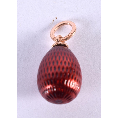 1122 - A RUSSIAN 14CT GOLD AND ENAMEL EGG PENDANT. 2.2 grams. 2 cm x 1.25 cm.