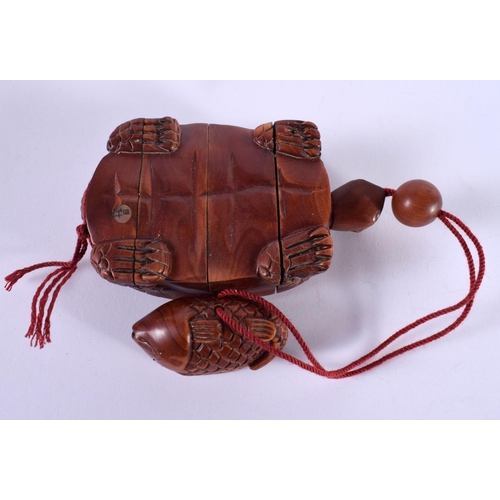 1127 - A JAPANESE CARVED HARDWOOD INTO IN THE FORM OF A TORTOISE.  10cm x 5.8 cm x 2.5cm, weight 67g