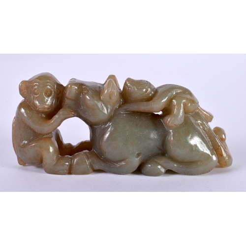 1128 - A GREEN JADE CARVING OF TWO MONKEYS PLAYING WITH A BEAST.  3.5cm x 8.+9cm x 2.3cm, weight 98g