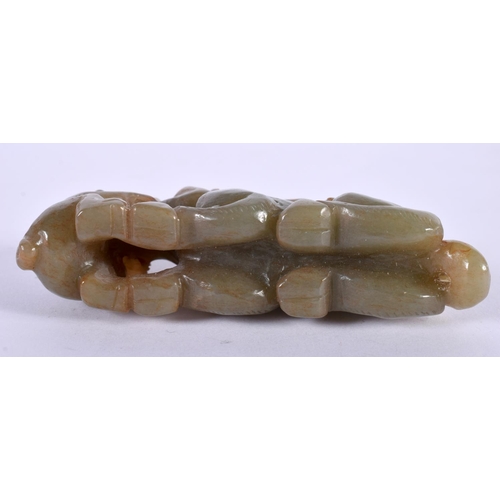 1128 - A GREEN JADE CARVING OF TWO MONKEYS PLAYING WITH A BEAST.  3.5cm x 8.+9cm x 2.3cm, weight 98g