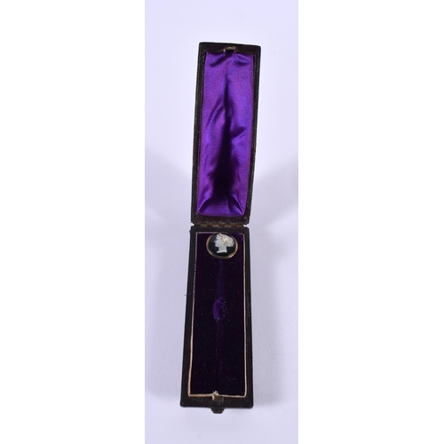 1129 - A CASED CAMEO STICK PIN.  8 cm x 1.75cm, weight 3.7g (without box)