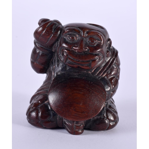 1135 - A JAPANESE CARVED HARDWOOD NETSUKE IN THE FORM OF A SEATED MALE. 4.8 cm x 4.3cm x 4.2 cm