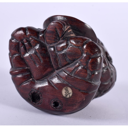 1135 - A JAPANESE CARVED HARDWOOD NETSUKE IN THE FORM OF A SEATED MALE. 4.8 cm x 4.3cm x 4.2 cm