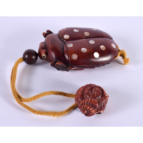 1138 - A JAPANESE HARDWOOD INRO IN THE FORM OF A BEETLE WITH INLAID MOTHER OF PEARL.  8.3cm x 5.3cm x 2.3cm... 