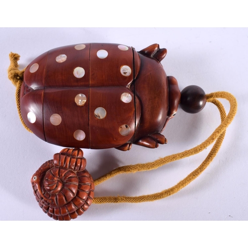 1138 - A JAPANESE HARDWOOD INRO IN THE FORM OF A BEETLE WITH INLAID MOTHER OF PEARL.  8.3cm x 5.3cm x 2.3cm... 