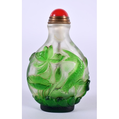 1141 - A CHINESE PEKING GLASS SNUFF BOTTLE OVERLAID WITH GREEN GLASS FOLIAGE.  7.2 cm x 4.5cm x 2.6 cm, wei... 