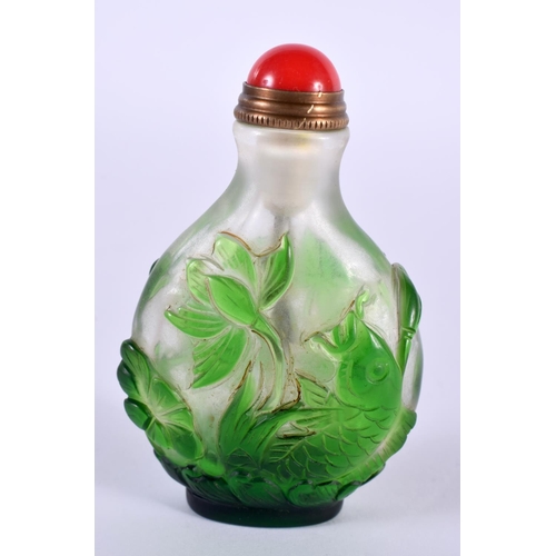 1141 - A CHINESE PEKING GLASS SNUFF BOTTLE OVERLAID WITH GREEN GLASS FOLIAGE.  7.2 cm x 4.5cm x 2.6 cm, wei... 