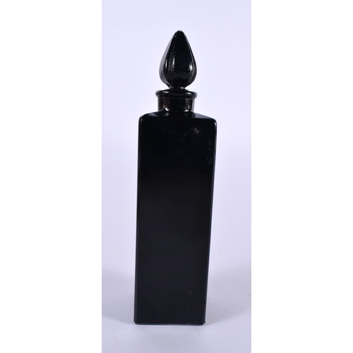 1144 - A CASED FRENCH BLACK GLASS SCENT BOTTLE.  10cm x 2.5cm x 2.5cm (bottle)