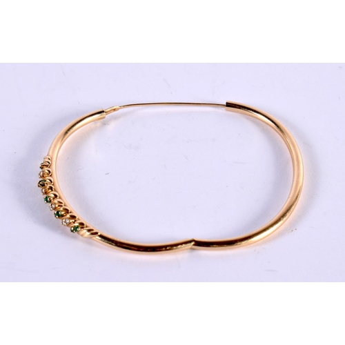 1150 - A 14CT GOLD BANGLE SET WITH EMERALDS AND DIAMONDS.  Stamped 14K, 5.8 cm x 5cm, weight 7.5g