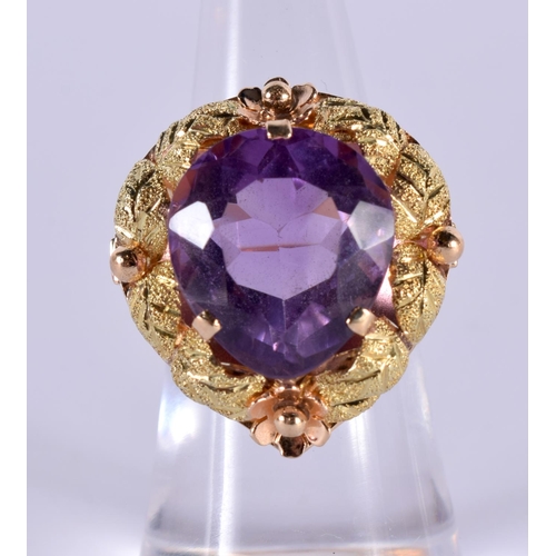 1162 - AN 18CT GOLD RING SET WITH A SINGLE AMETHYST.  Size K, Stamped 18K, weight 8.6g