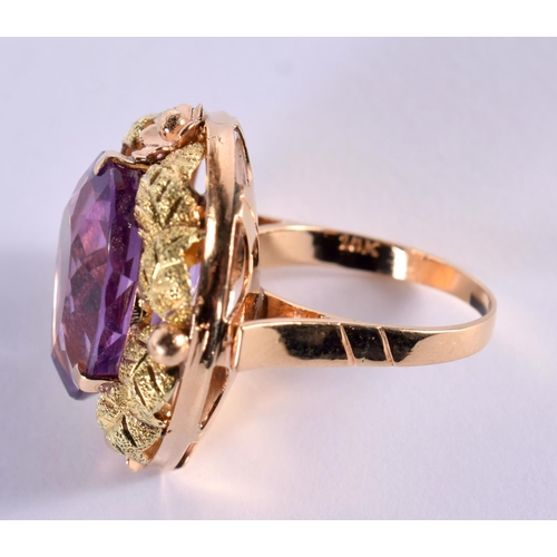 1162 - AN 18CT GOLD RING SET WITH A SINGLE AMETHYST.  Size K, Stamped 18K, weight 8.6g