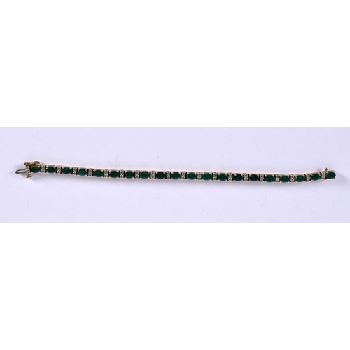 1167 - A 14CT GOLD BRACELET SET WITH EMERALDS AND DIAMONDS.  Stamped 14K, length 18cm, weight 17.3g