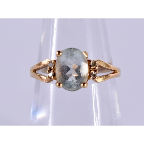 1176 - A 14CT GOLD RING SET WITH AN AQUA AND 4 DIAMONDS.  Stamped 14K, Size L/M, weight 2.6g