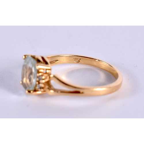 1176 - A 14CT GOLD RING SET WITH AN AQUA AND 4 DIAMONDS.  Stamped 14K, Size L/M, weight 2.6g