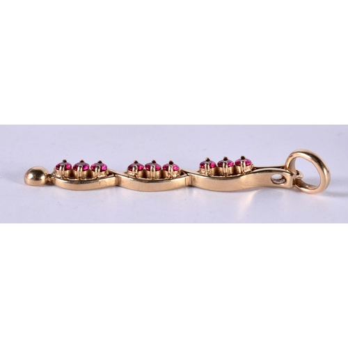 1187 - A 14CT GOLD DROP PENDANT SET WITH RUBIES.  Stamped 14K, 5.5cm x 0.7cm, weight 5.6g