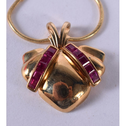 1195 - A 14CT GOLD AND RUBY NECKLACE.  Stamped 14K, Pendant 2.6 cm, chain 41cm, weight 13g