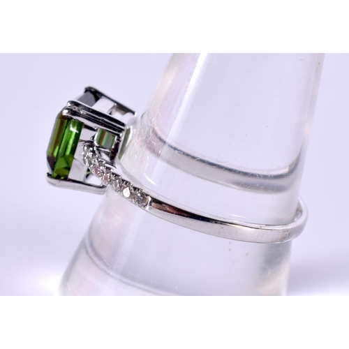 1199 - AN 18CT WHITE GOLD RING WITH DIAMOND ENCRUSTED SHOULDERS SET WITH A TOURMALINE.  Size Q, Stamped 750... 