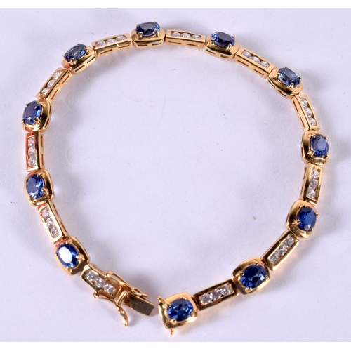 1201 - A SILVER GILT BRACELET SET WITH SAPPHIRES AND CZ.  Stamped 925, length 18.5cm, weight 11g