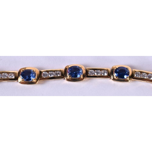 1201 - A SILVER GILT BRACELET SET WITH SAPPHIRES AND CZ.  Stamped 925, length 18.5cm, weight 11g