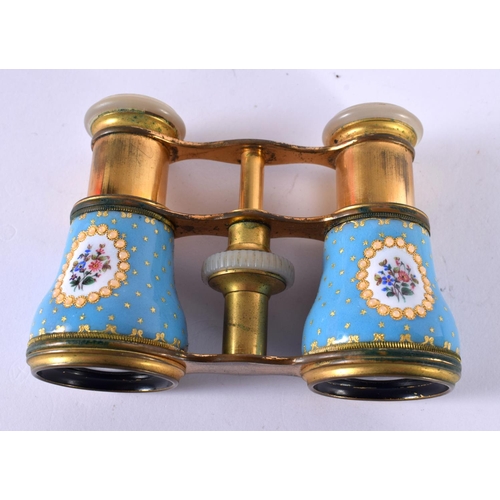 1202 - A CASED PAIR OF EDWARDIAN OPERA GLASSES WITH GILT AND ENAMEL DECORATION AND MOTHER OF PEARL EYE PADS... 