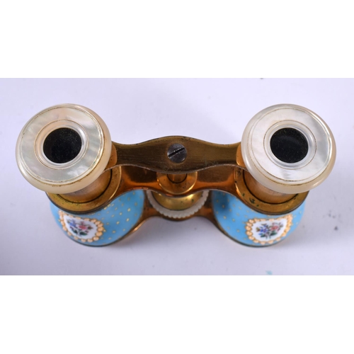 1202 - A CASED PAIR OF EDWARDIAN OPERA GLASSES WITH GILT AND ENAMEL DECORATION AND MOTHER OF PEARL EYE PADS... 