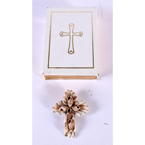 1203 - A SHELL CRUCIFIX BROOCH IN A BIBLE BOX.  5.8 cm x 4.5cm