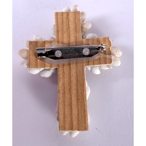 1203 - A SHELL CRUCIFIX BROOCH IN A BIBLE BOX.  5.8 cm x 4.5cm