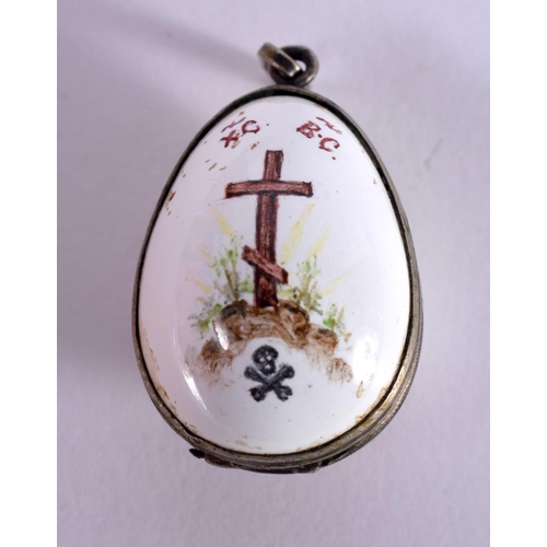 1208 - AN ENAMEL EGG PENDANT DECORATED WITH CHRIST WEARING A CROWN OF THORNS.  2.8 cm X 1.8 cm, weight 9g