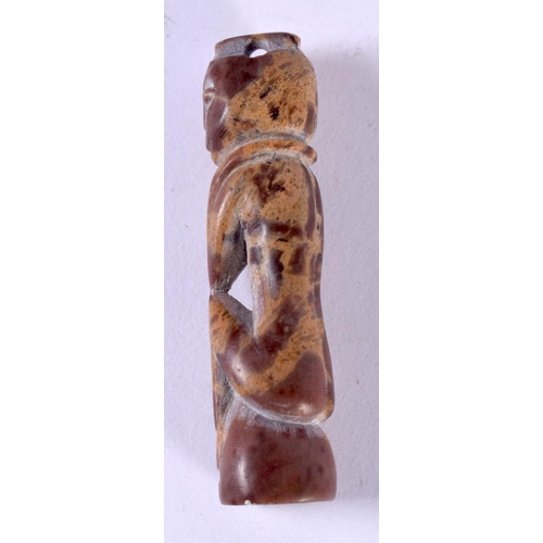 1217 - AFRICAN TRIBAL CARVED HARDSTONE PENDANT IN THE FORM OF A SEATED MALE.  5cm x 1.1cm x 1.2 cm, weight ... 