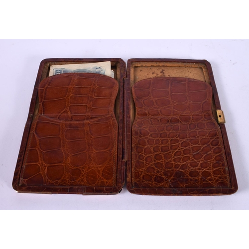 1228 - A LEATHER WALLET WITH 9CT GOLD CORNER MOUNTS.  16cm x 10cm x 1.5cm, Stamped 375