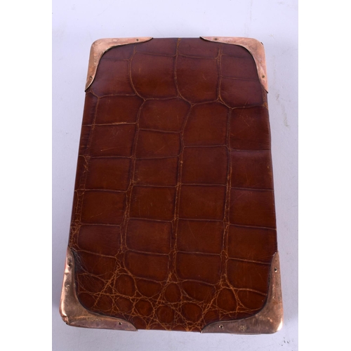 1228 - A LEATHER WALLET WITH 9CT GOLD CORNER MOUNTS.  16cm x 10cm x 1.5cm, Stamped 375