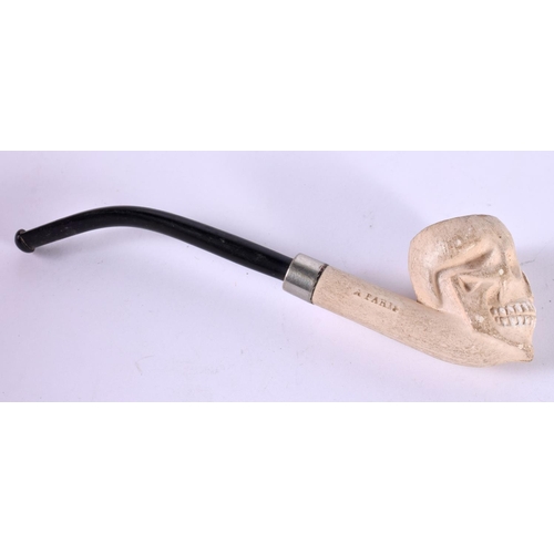 1240 - A CLAY PIPE FORMED AS A SKULL.  16cm x 2.9cm x 4.3cm, weight 35g