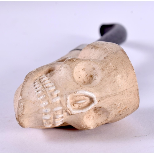 1240 - A CLAY PIPE FORMED AS A SKULL.  16cm x 2.9cm x 4.3cm, weight 35g